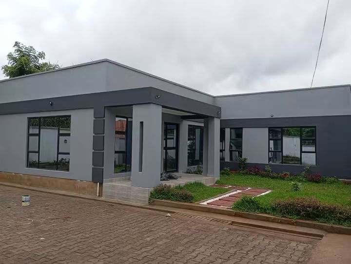 Completed grey exterior with covered entrance portico