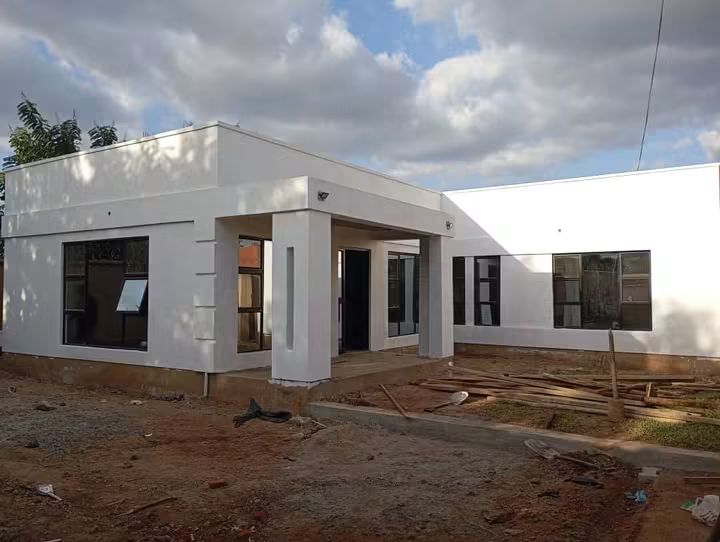 Freshly painted white exterior under construction