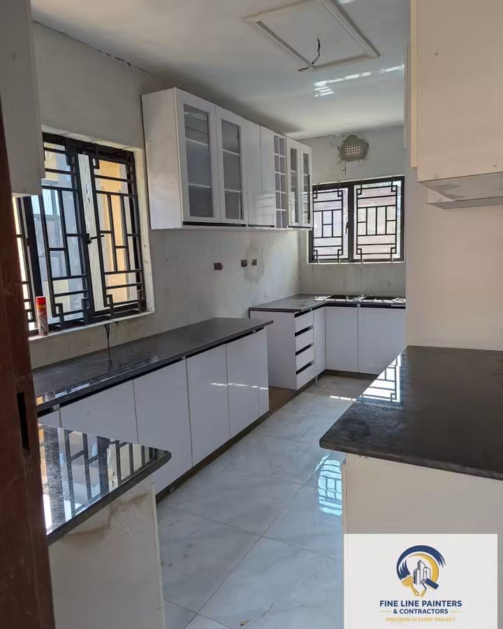White fitted kitchen with granite worktops
